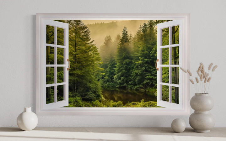 Fake window wall art showing a foggy pine forest and river through an open white frame.