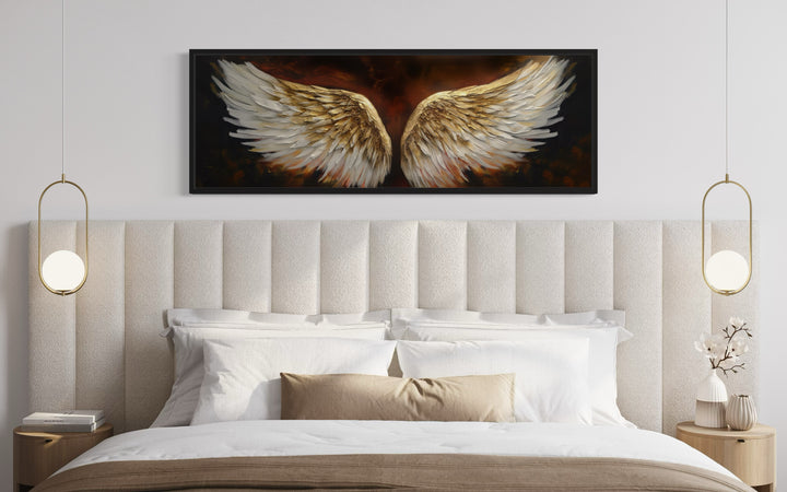 White Gold Angel Wings On Brown Background Horizontal Framed Canvas Wall Art above white bed