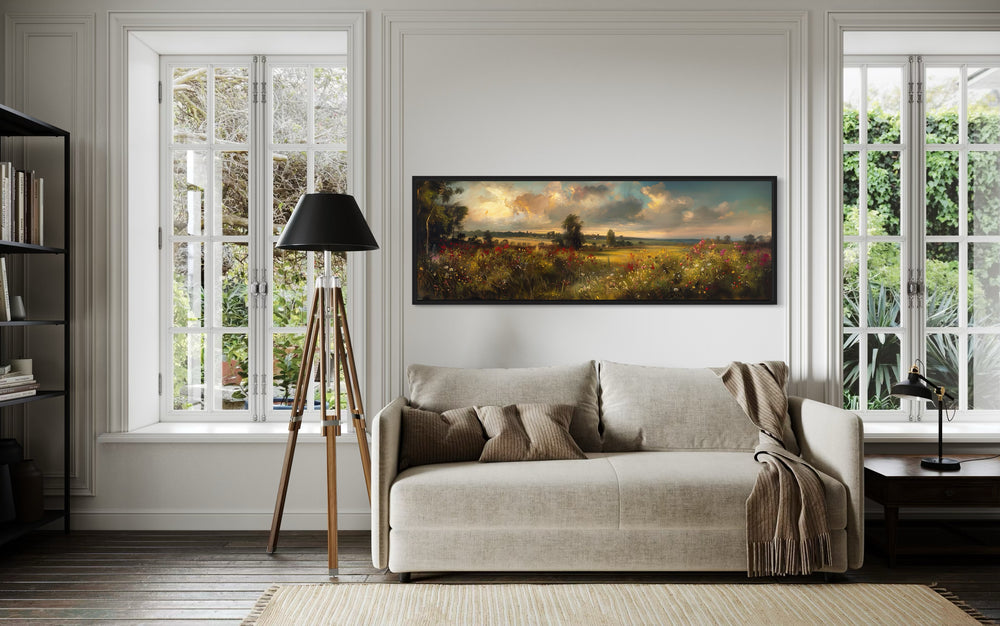 Vintage Wildflowers Field Landscape at Sunset Panoramic Canvas Wall Art in a living room with a couch