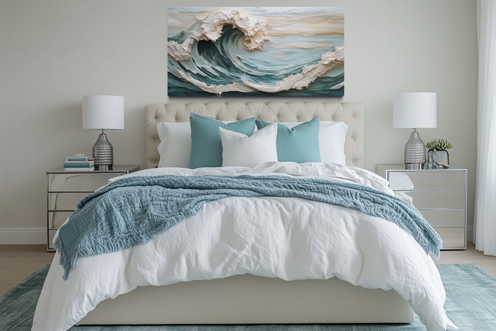 Abstract 3D effect teal ocean wave framed canvas wall art hanging above a bed in a modern bedroom.