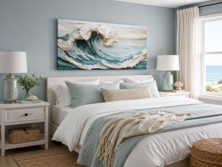 Abstract 3D effect teal ocean wave framed canvas wall art hanging above a bed in a coastal bedroom.