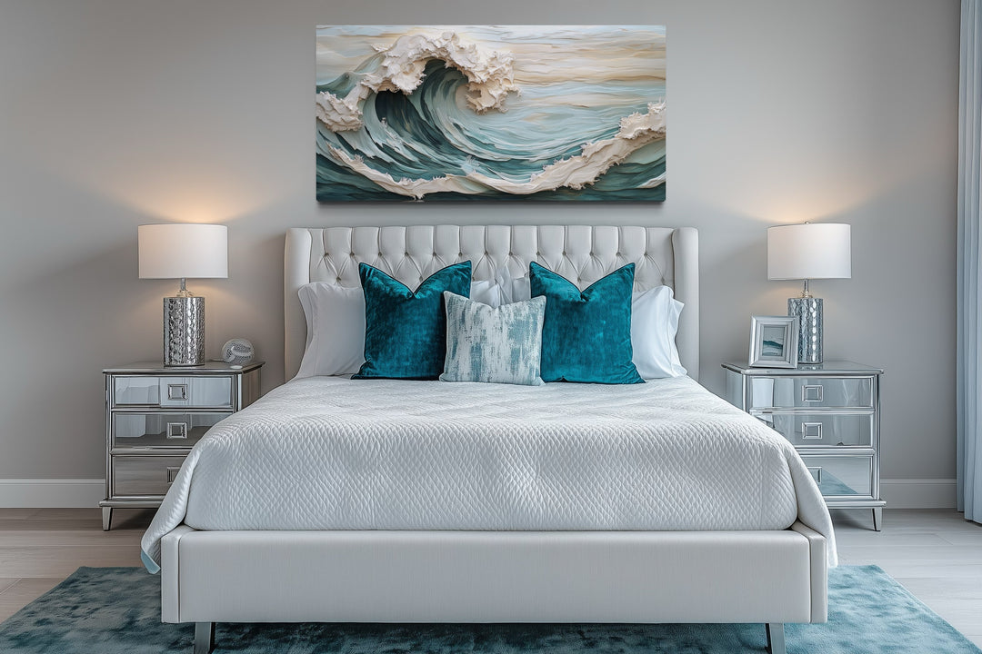 Abstract 3D effect teal ocean wave framed canvas wall art hanging above a white tufted bed.