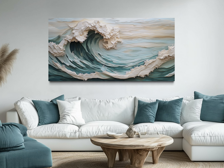 Abstract 3D effect teal ocean wave framed canvas wall art hanging above a white sectional sofa.