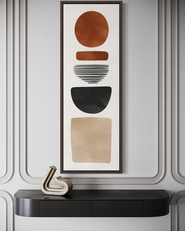 Tall narrow canvas wall art featuring stacked abstract geometric shapes in earthy terracotta tones.