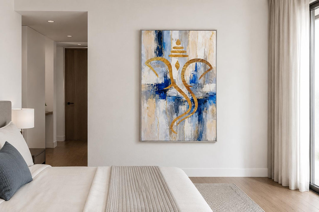 Abstract gold Ganesha silhouette wall art on a textured blue, white, and gold background.