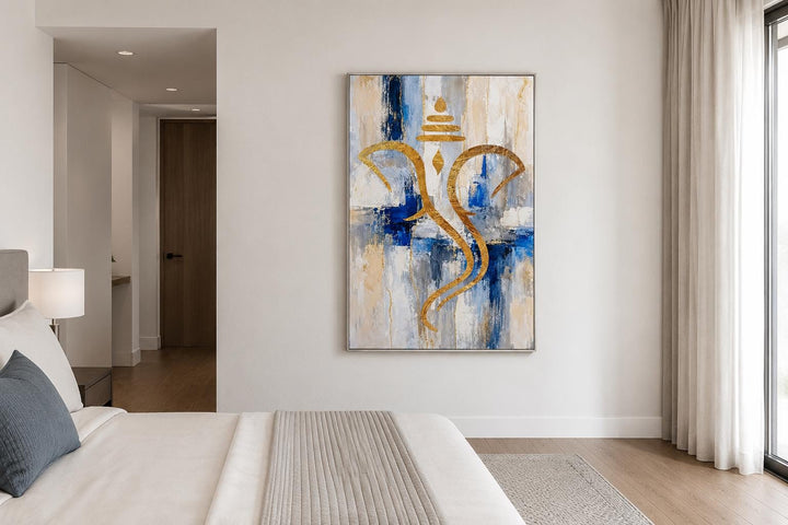 Abstract gold Ganesha silhouette wall art on a textured blue, white, and gold background.