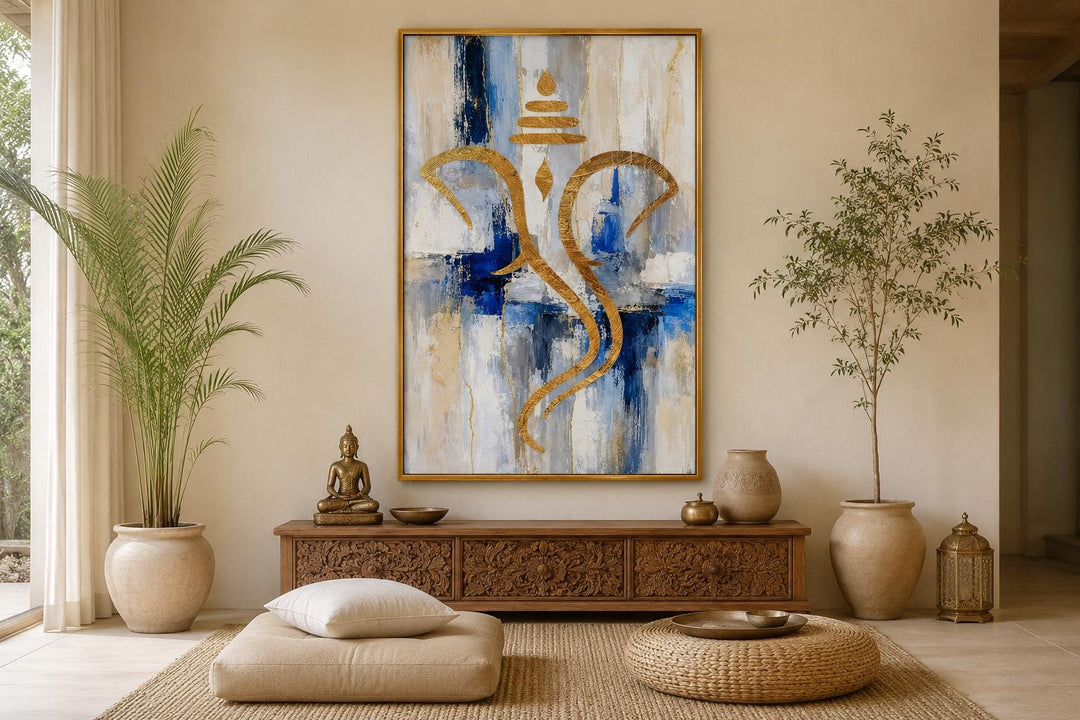 Abstract gold Ganesha silhouette wall art on a textured blue, white, and gold background.