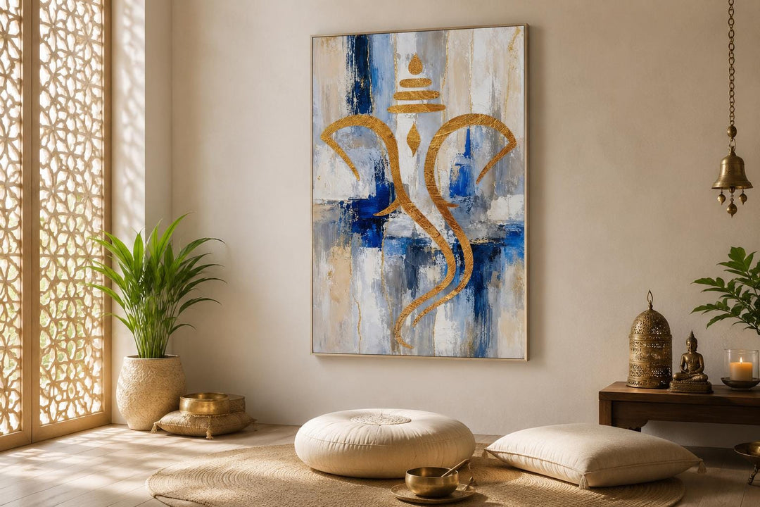 Abstract gold Ganesha silhouette wall art on a textured blue, white, and gold background.