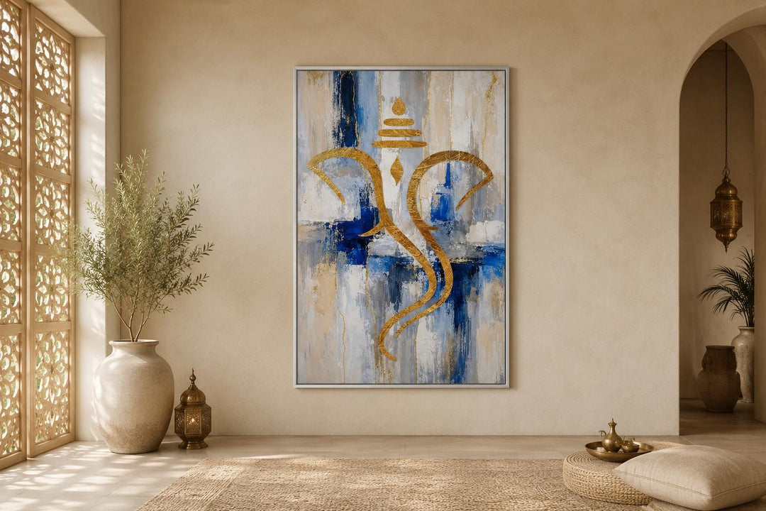 Abstract gold Ganesha silhouette wall art on a textured blue, white, and gold background.