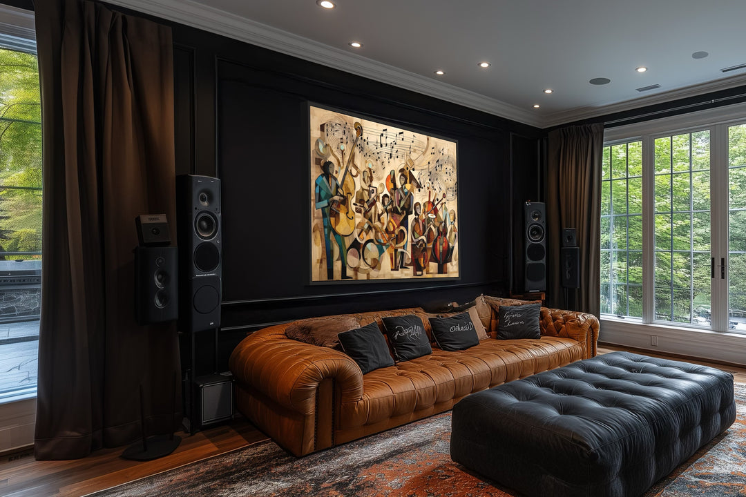 Abstract jazz orchestra framed canvas wall art hanging above a brown leather sofa in a dark room.
