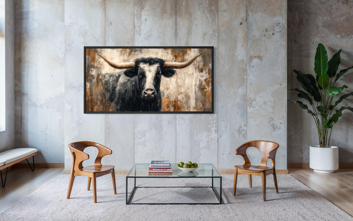 Abstract longhorn bull canvas wall art in a modern industrial living room setting.