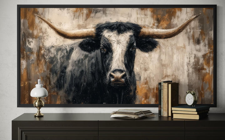 Abstract Longhorn Bull canvas wall art in a modern industrial style above a dark wood dresser.