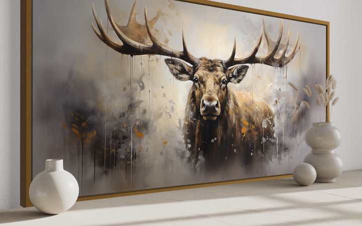 Extra large framed abstract moose canvas print in a rustic cabin setting with neutral decor.