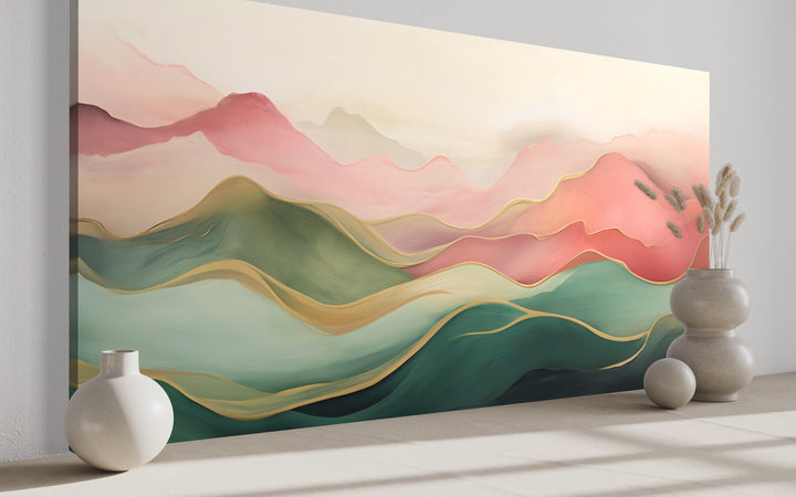 Abstract mountain wall art canvas with soft blush pink, green, and gold wavy landscape layers.