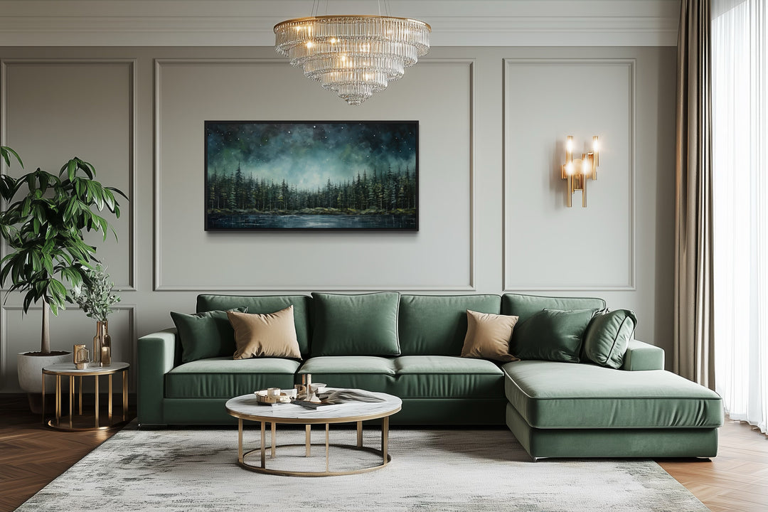 Abstract starry sky wall art featuring a green fir forest and tranquil lake above a green sofa.