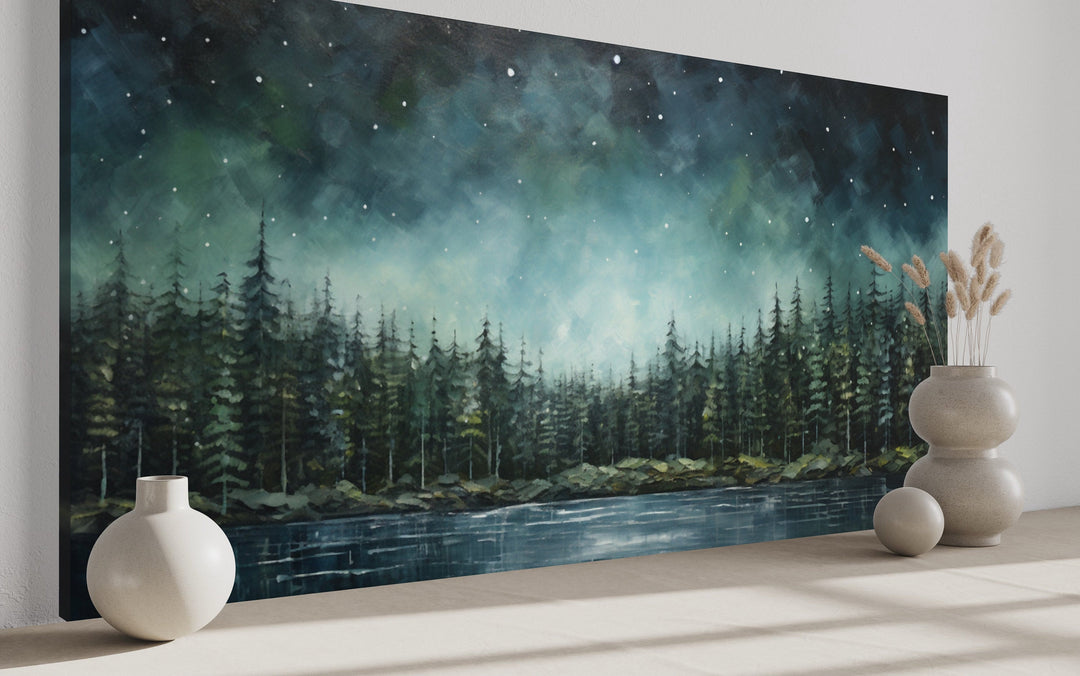 Abstract starry sky over a green fir forest and tranquil lake canvas wall art in a modern room.