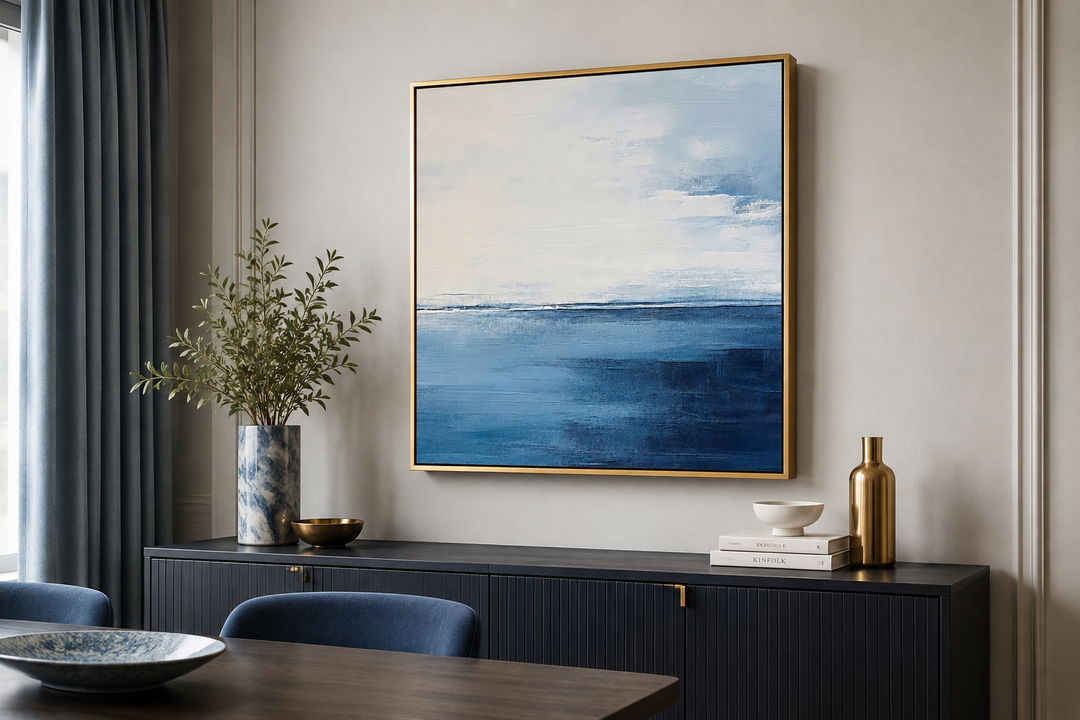 Abstract square framed canvas wall art featuring ocean tones of navy blue, grey, and silver.