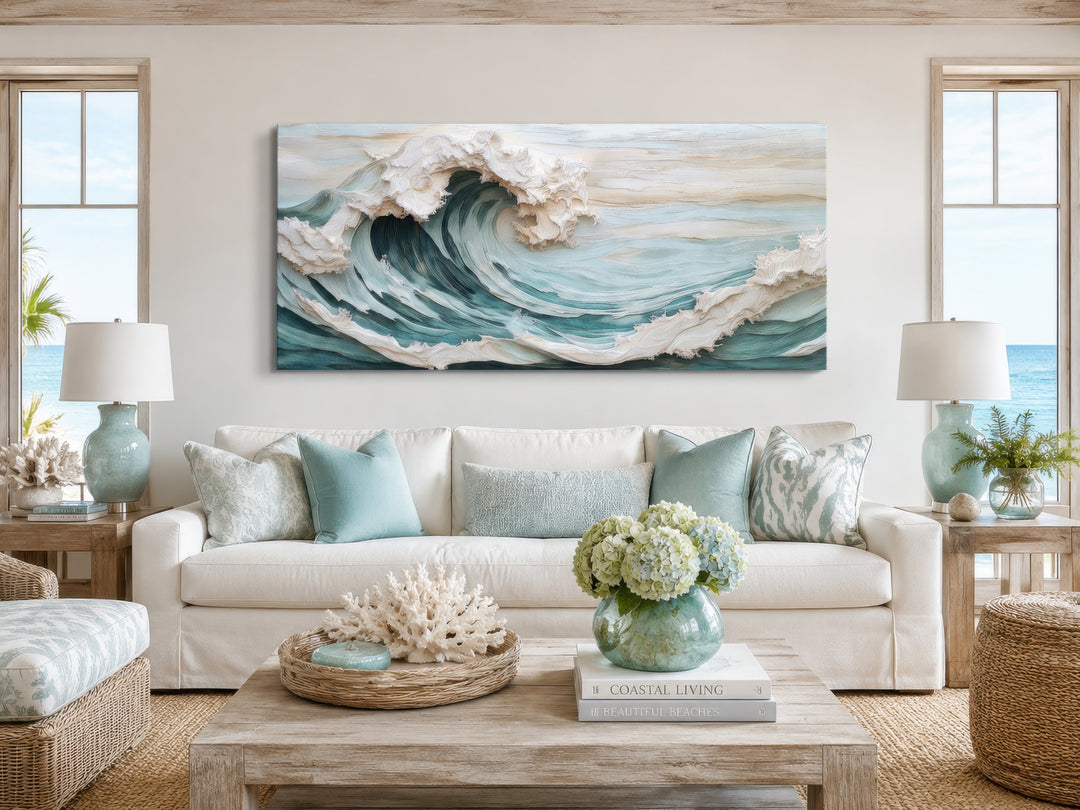 Abstract 3D effect teal ocean wave framed canvas wall art hanging above a white sofa.