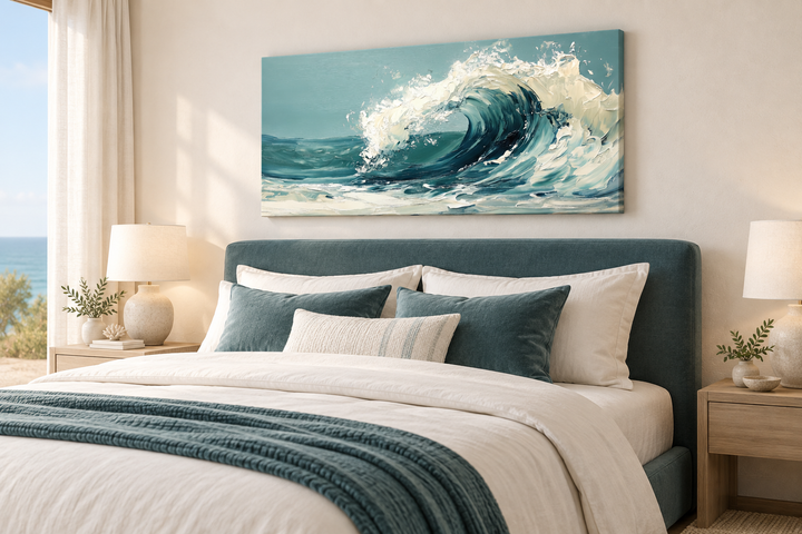 Abstract teal ocean wave framed canvas wall art hanging above a bed in a coastal bedroom.