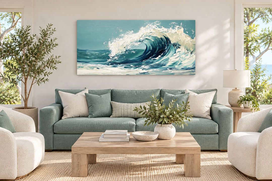 Abstract teal ocean wave framed canvas wall art hanging above a sofa in a coastal living room.