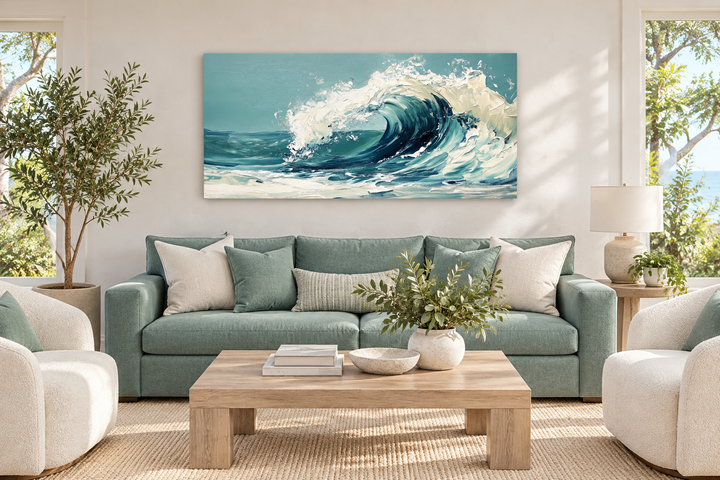 Abstract teal ocean wave framed canvas wall art hanging above a sofa in a coastal living room.