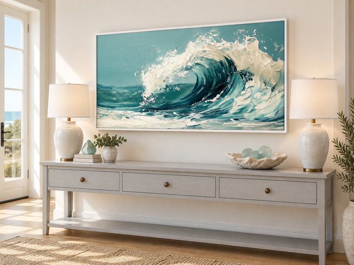 Abstract teal ocean wave framed canvas wall art hanging above a grey console table.