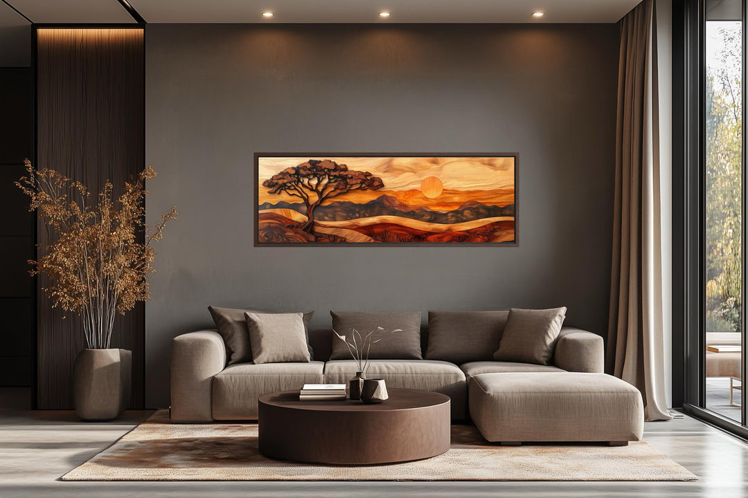 Acacia tree wall art in a wood carving style on a long narrow canvas above a modern sofa.