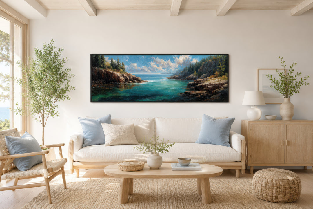 Panoramic Acadia National Park canvas wall art above a white sofa in a bright, coastal living room.