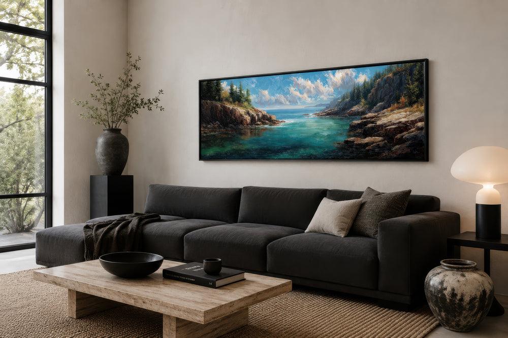 Panoramic Acadia National Park canvas wall art featuring rocky cliffs and sea above a dark sofa.