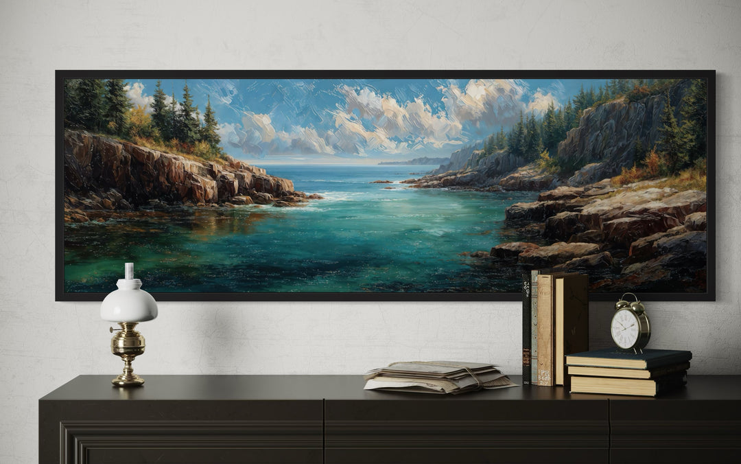 Panoramic Acadia National Park canvas wall art of a rocky coastline and blue sea above a sideboard.