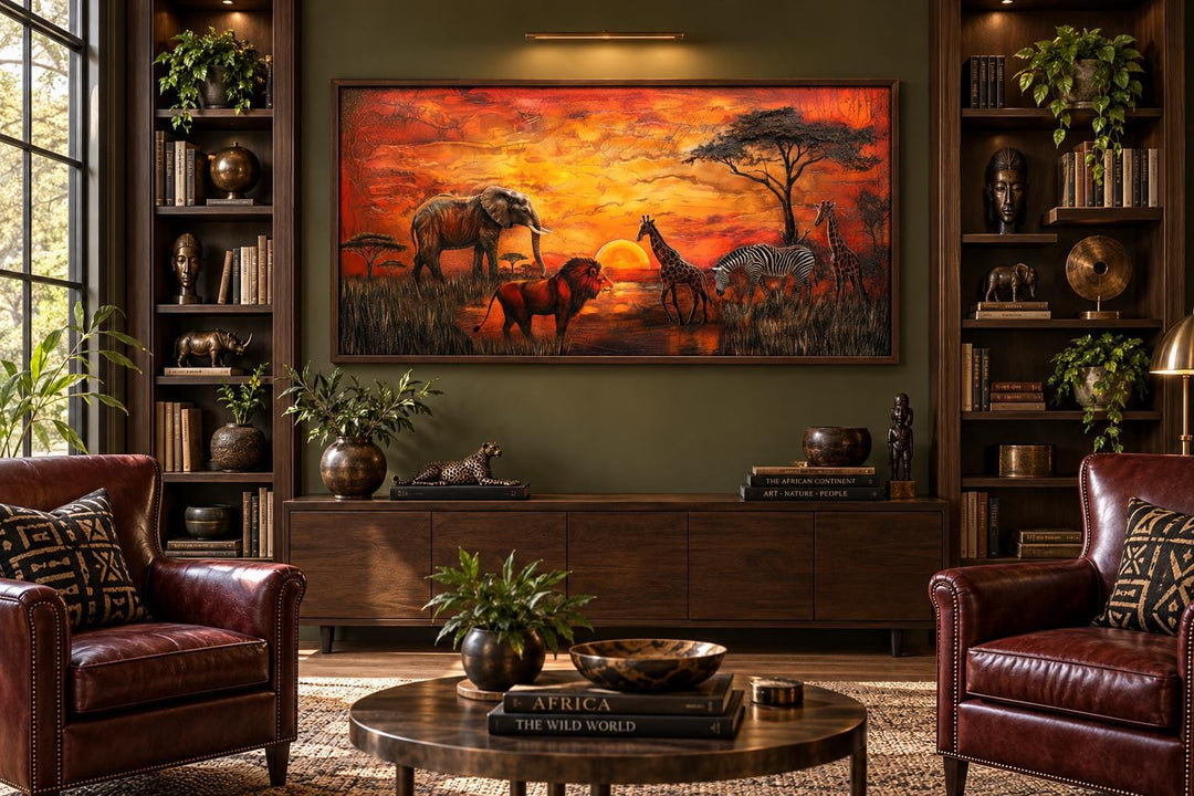 African animals in savannah at sunset framed canvas wall art above a dark wood console table.