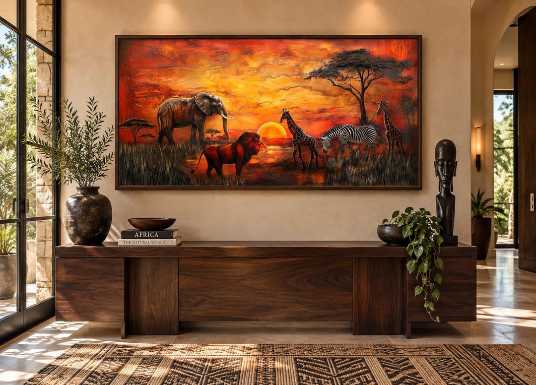 African Animals In Savannah At Sunset Framed Canvas Wall Art above a wooden console table.