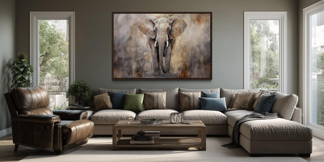 Extra large abstract African elephant canvas wall art hanging above a modern sectional sofa.