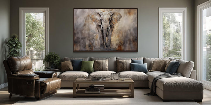 Extra large abstract African elephant canvas wall art hanging above a modern sectional sofa.