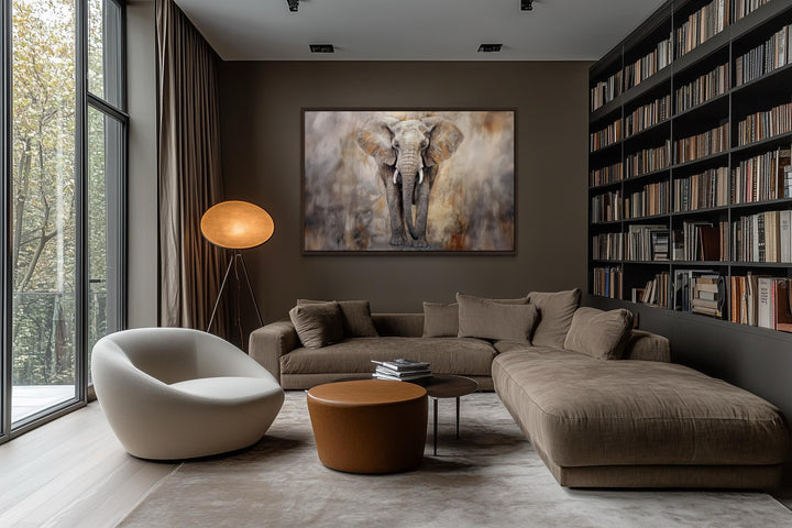 Extra large abstract canvas wall art of an African elephant in a modern living room with a bookshelf.