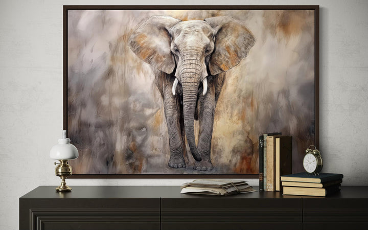 African Elephant Abstract Extra Large Canvas Wall Art in a dark wood frame above a console table.