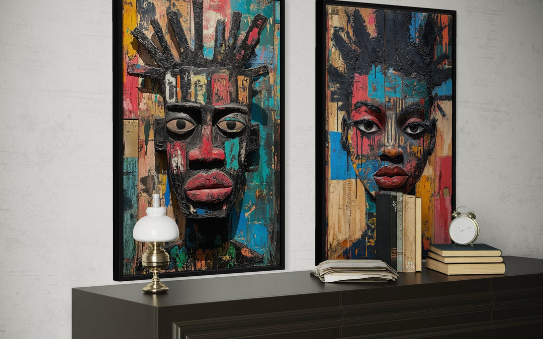 Set of two colorful African mask canvas prints featuring abstract tribal faces in bold jewel tones.