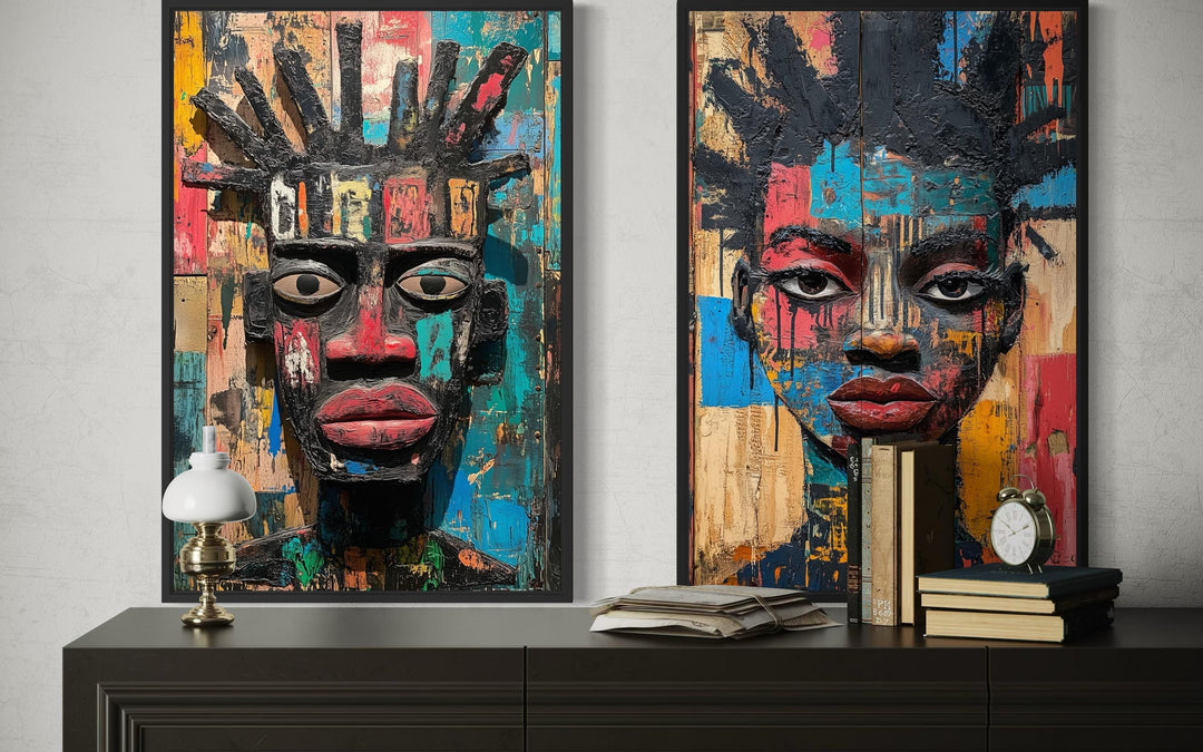 Set of two colorful African mask canvas prints featuring abstract tribal faces in a modern style.