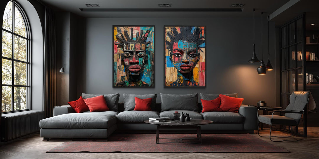 Set of two colorful African mask canvas prints featuring abstract tribal faces in a modern room.