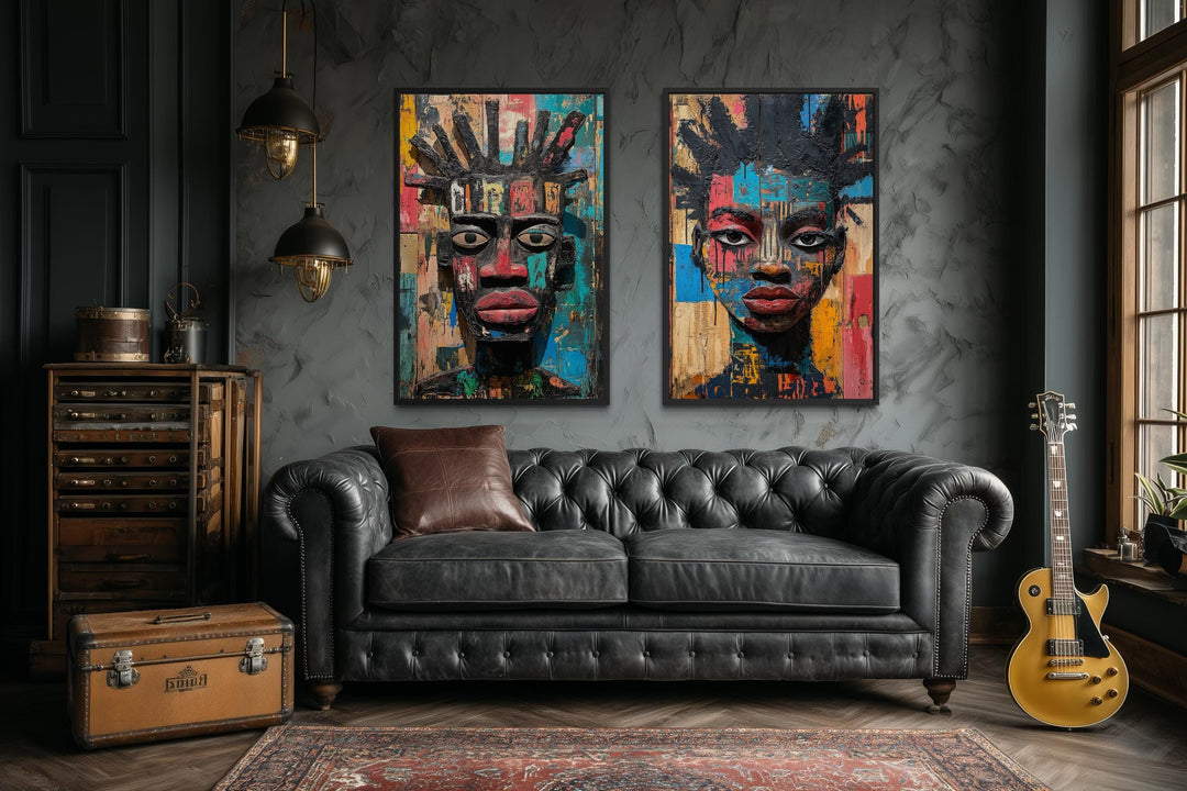 Set of two colorful African mask tribal face canvas prints displayed in a moody, modern living room.