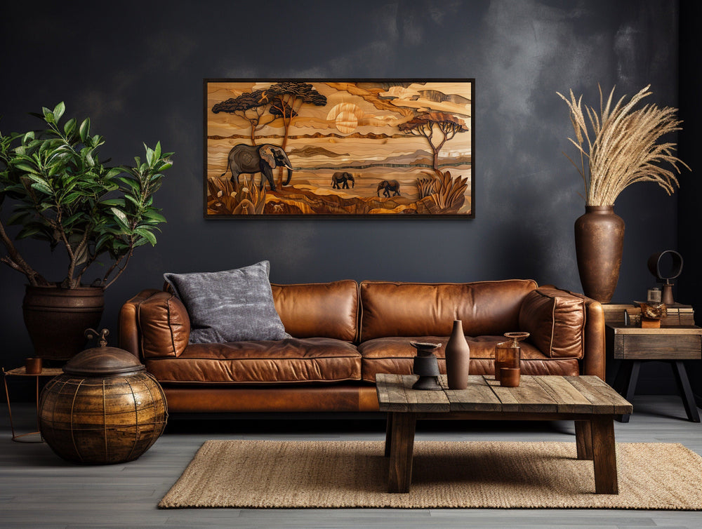 African Savanna With Elephants Framed Canvas Wall Art above brown couch