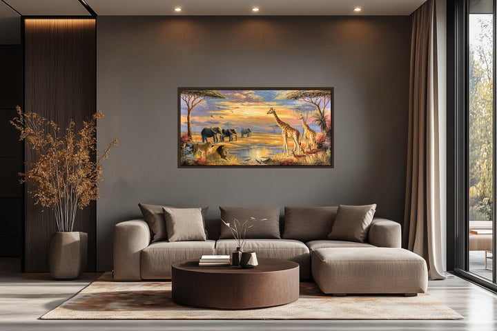 African wildlife safari canvas wall art featuring elephants and giraffes in a modern living room.