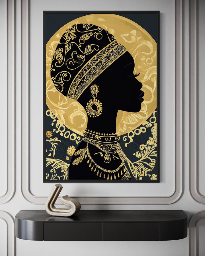 Framed black and gold canvas print of an African woman in profile with an ornate headwrap.