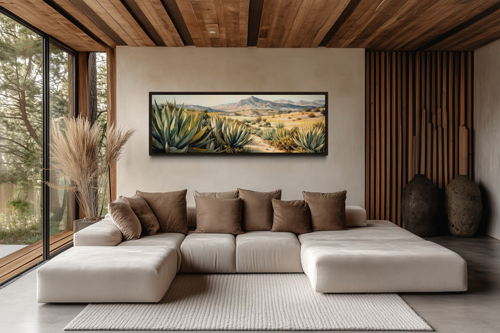 Agave in the desert horizontal framed canvas wall art hanging above a modern sectional sofa.