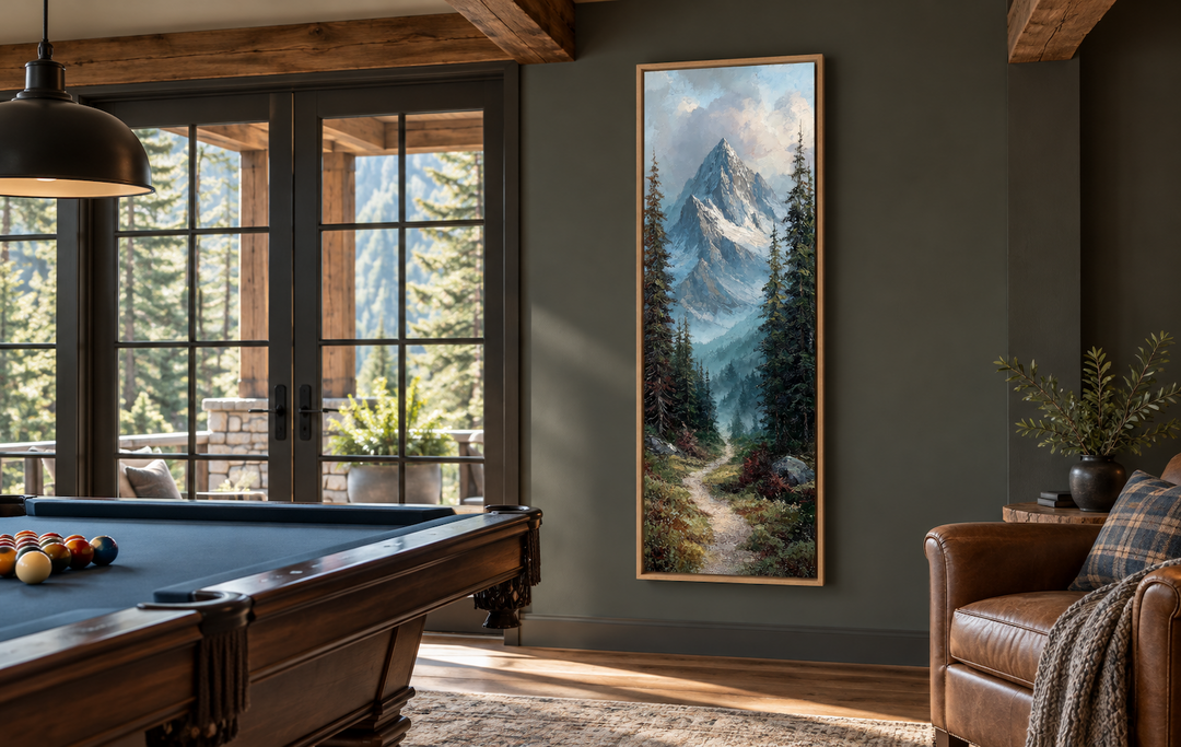 Slim vertical canvas art of a mountain path and snowy peaks in a rustic room with a pool table.