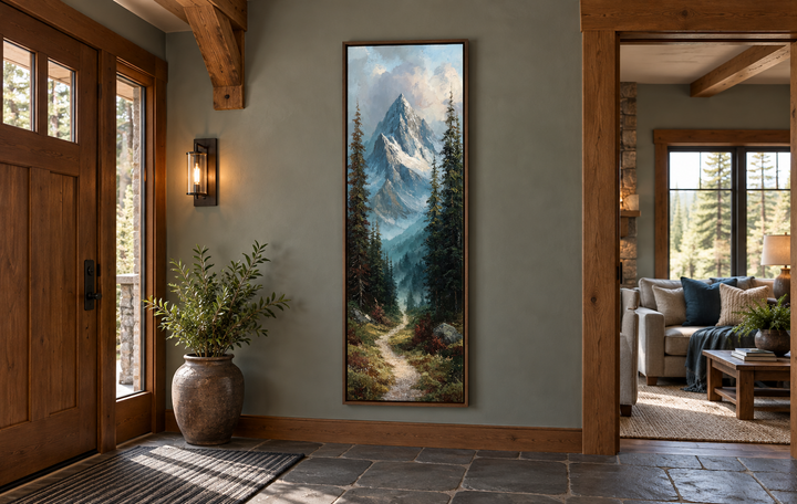 Slim narrow vertical canvas print of a mountain path and snowy peaks in a rustic entryway.