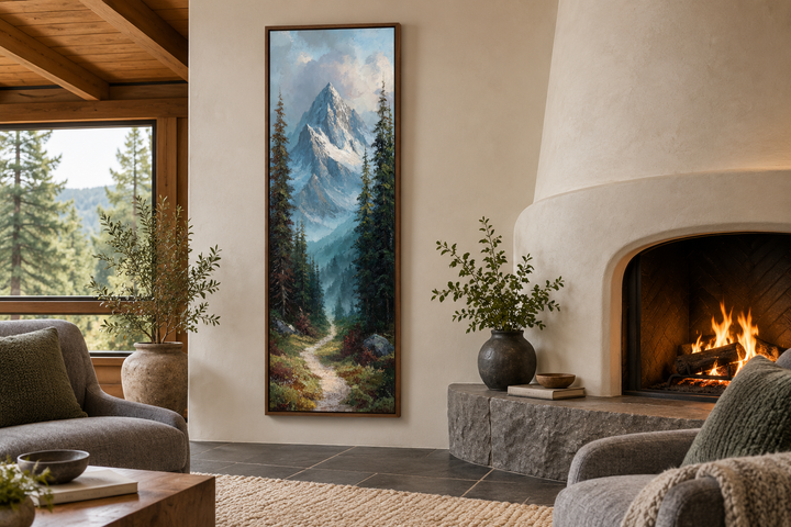 Slim narrow vertical canvas print of a snowy mountain peak and forest path in a rustic living room.