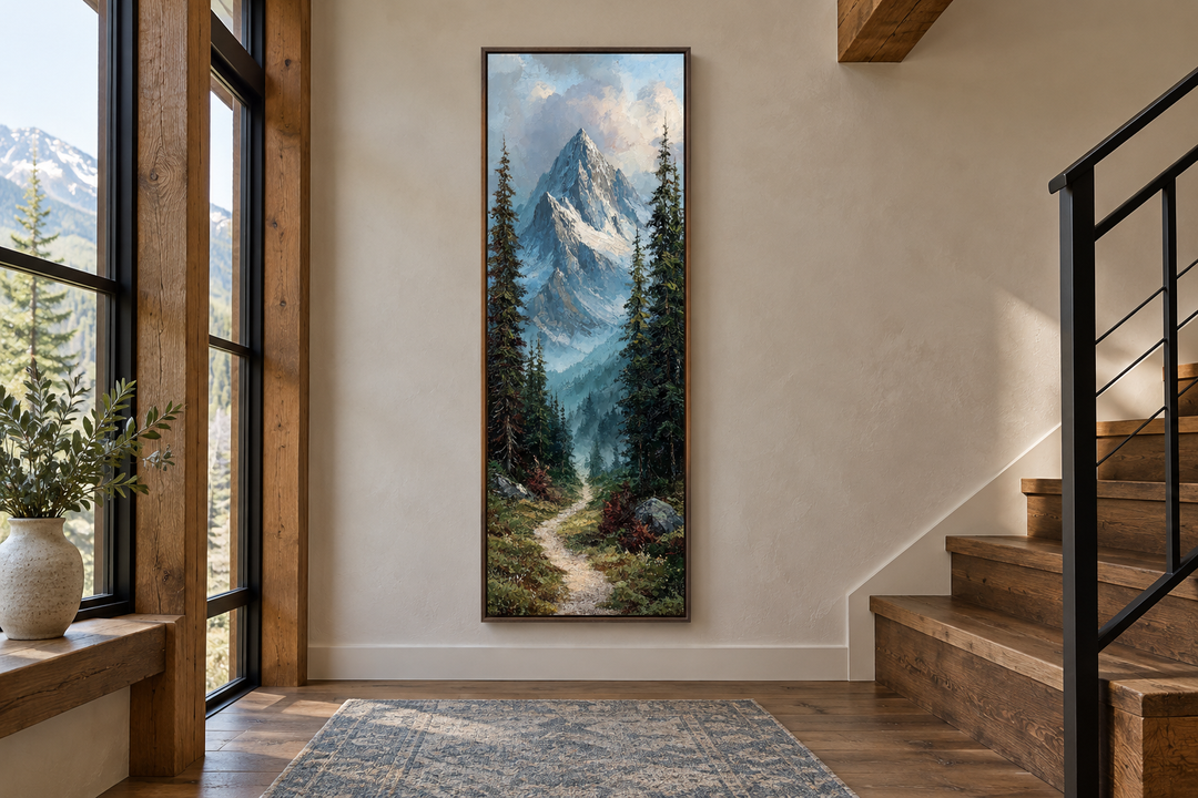 Slim vertical canvas print of a mountain path and pine trees in a rustic hallway by a staircase.