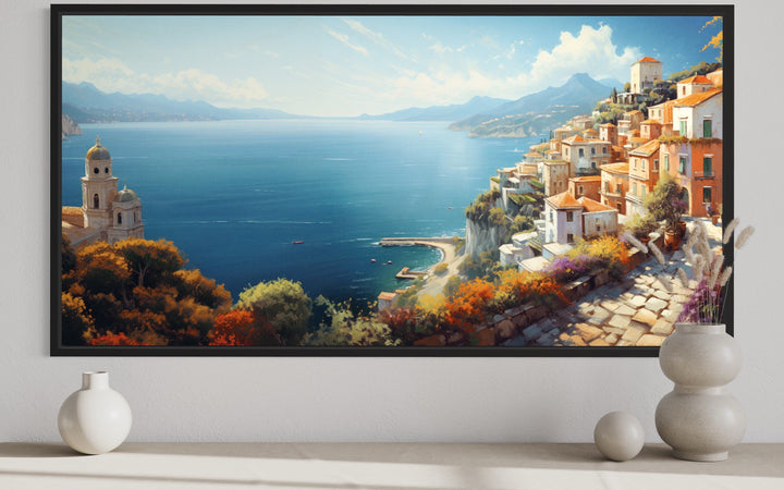 Framed canvas print of a vibrant Amalfi Coast painting featuring coastal towns and azure waters.