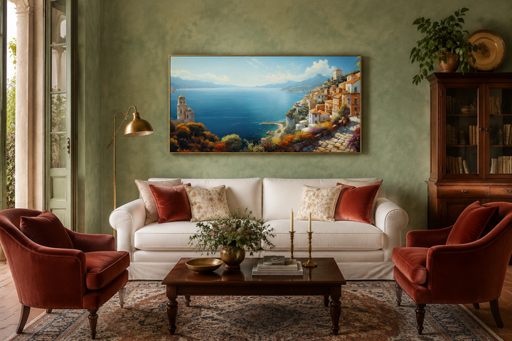 Large framed Amalfi Coast canvas wall art depicting a colorful Italian seaside town over a sofa.